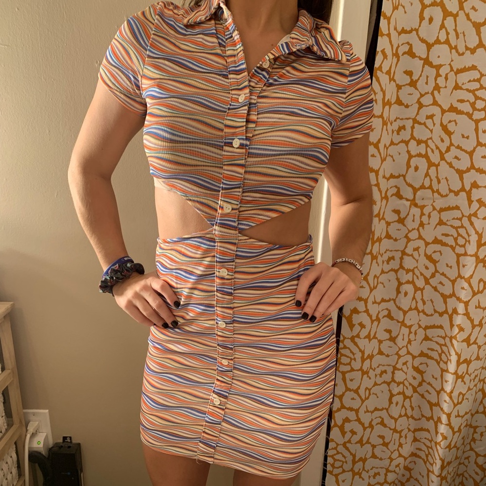 Colorful dress with collar and open sides. Only worn once for a special occasion